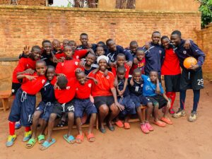 A group of young children wearing football shirts