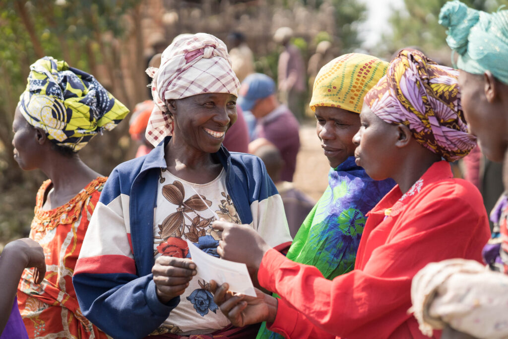 A woman handing over a piece of paper