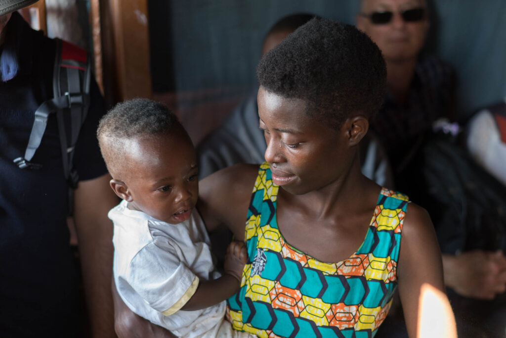 A mother holding her baby