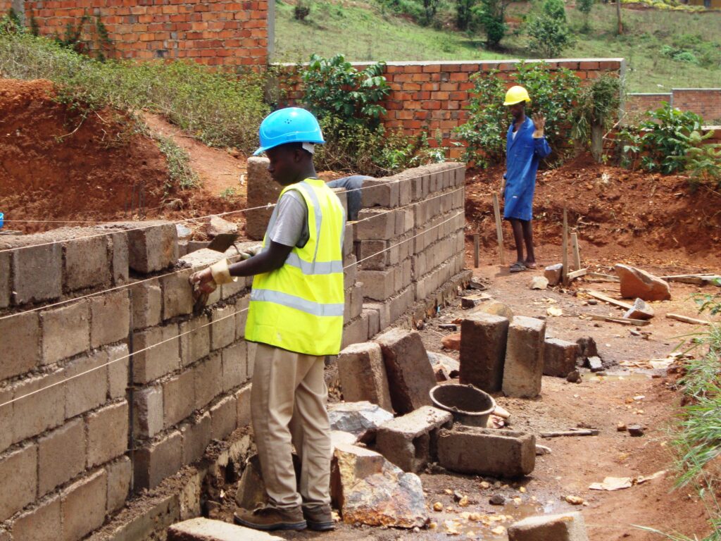 Men building a wall.